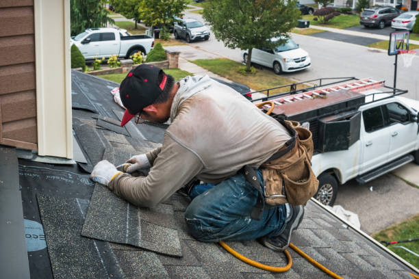 Professional Roof Replacement technician working in Romulus, NY